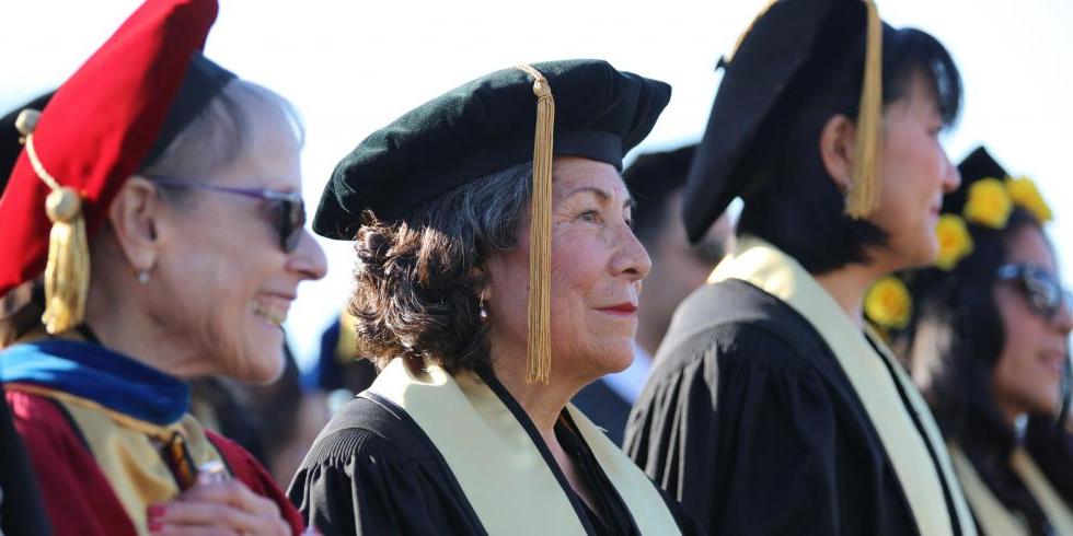 Doctoral students and professors at commencement